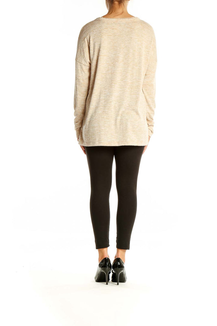 Back view of Doe & Rae beige V-neck sweater showing relaxed fit