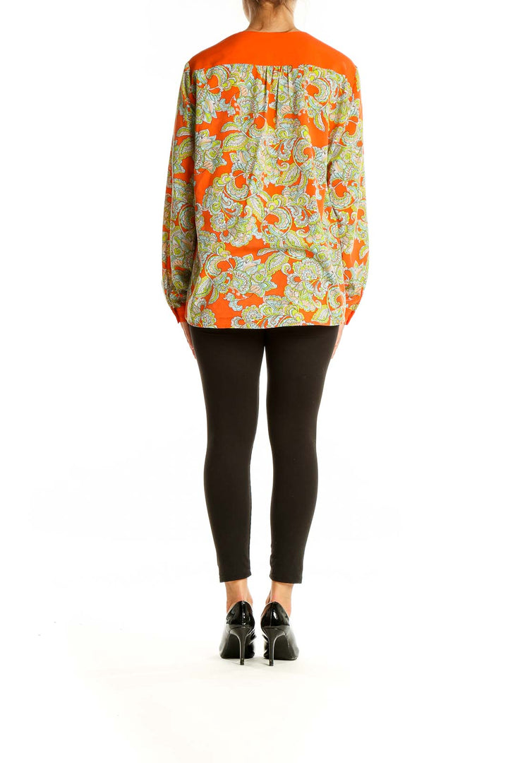 Back view of Jones New York orange floral blouse showing full pattern