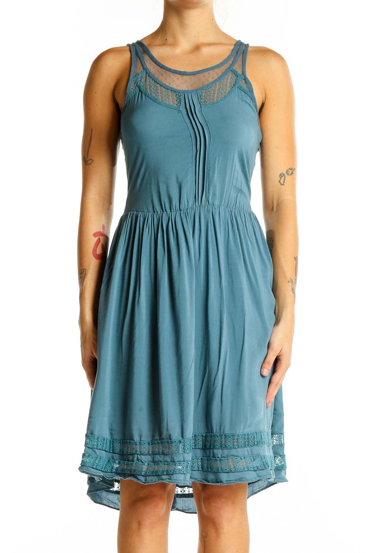 Front view of teal Gentle Fawn sleeveless dress with lace trim