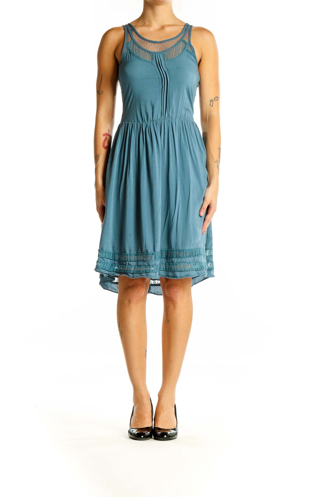 Front view of teal Gentle Fawn sleeveless dress with lace trim