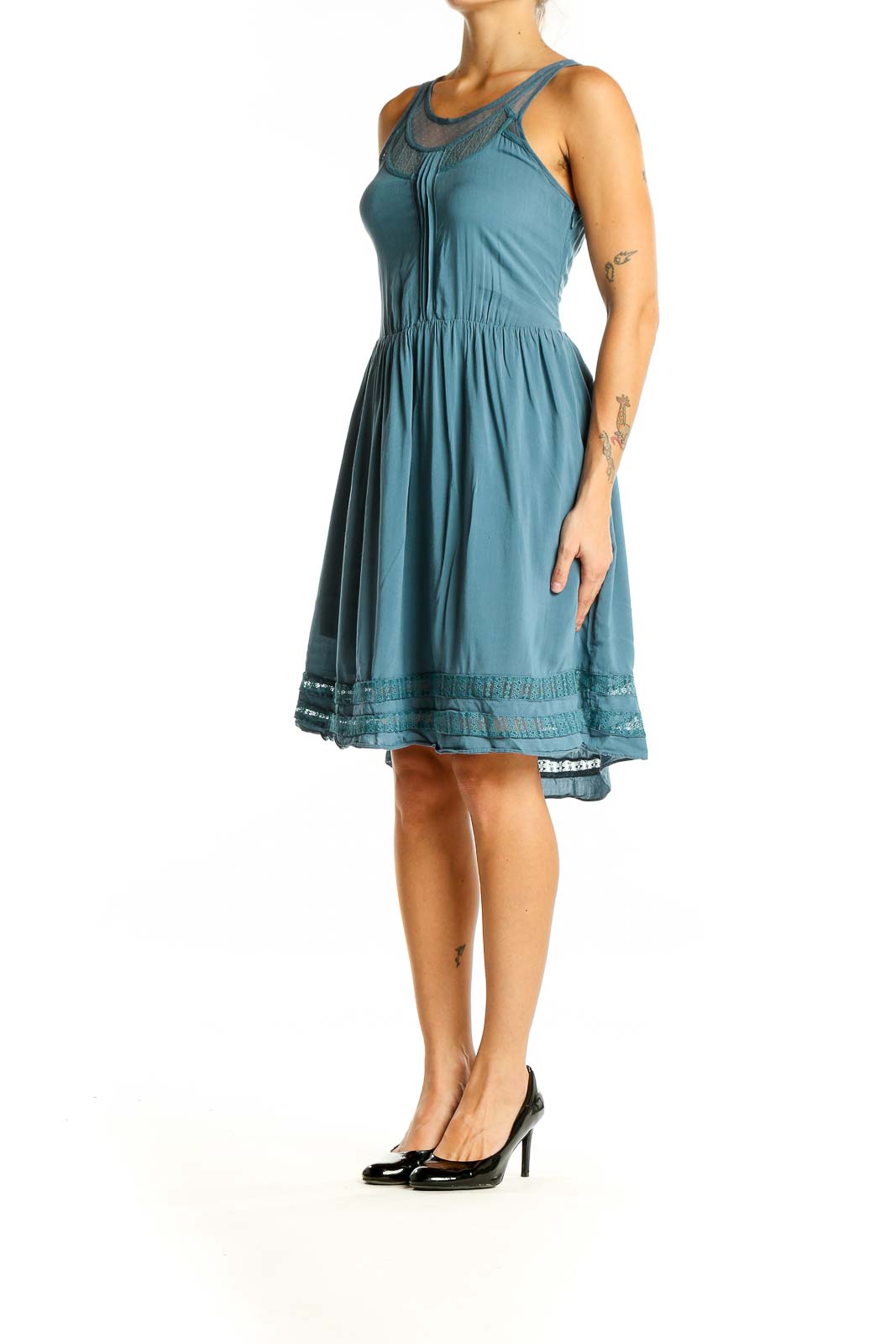 Front view of teal Gentle Fawn sleeveless dress with lace trim