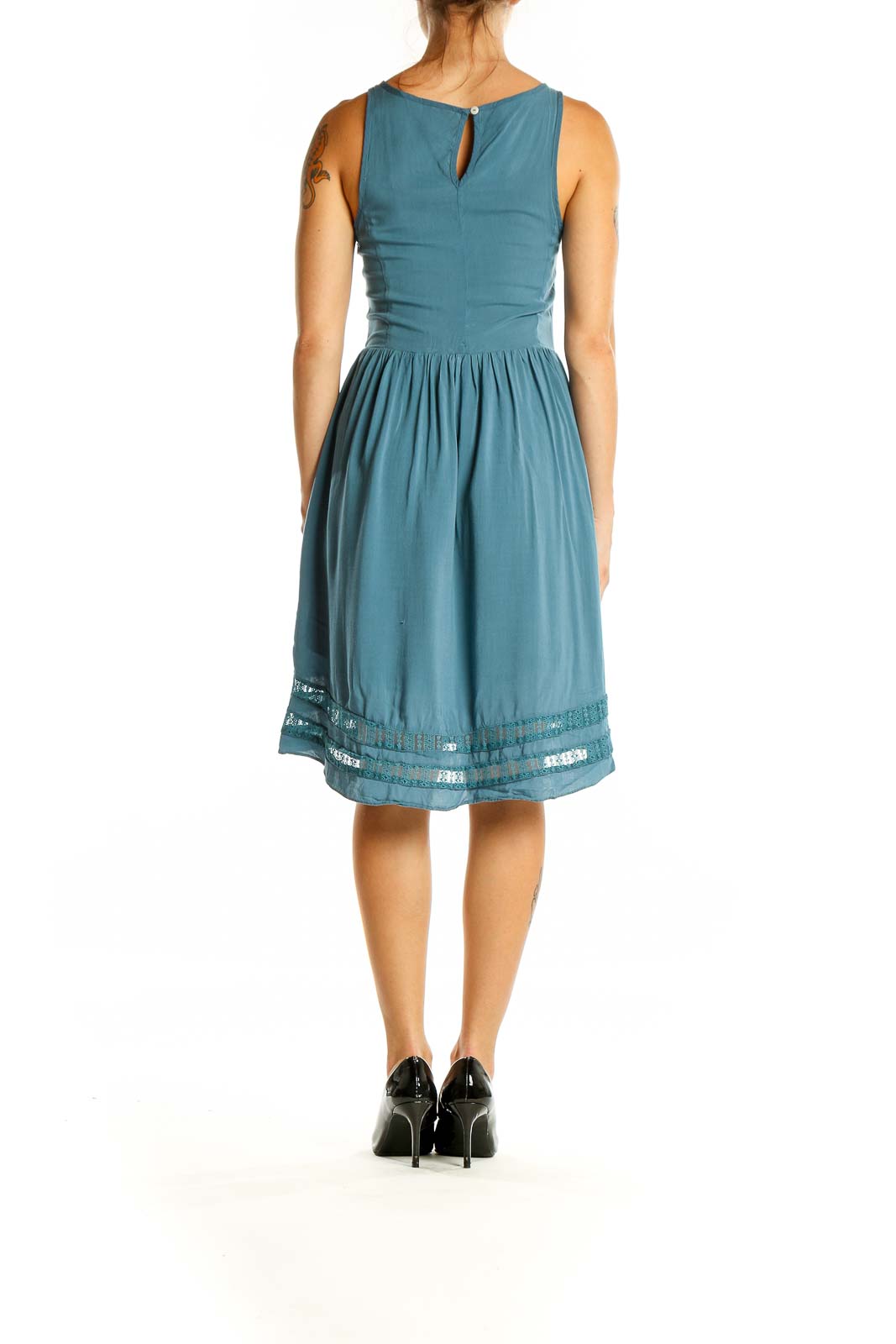 Back view of teal Gentle Fawn dress showing keyhole closure