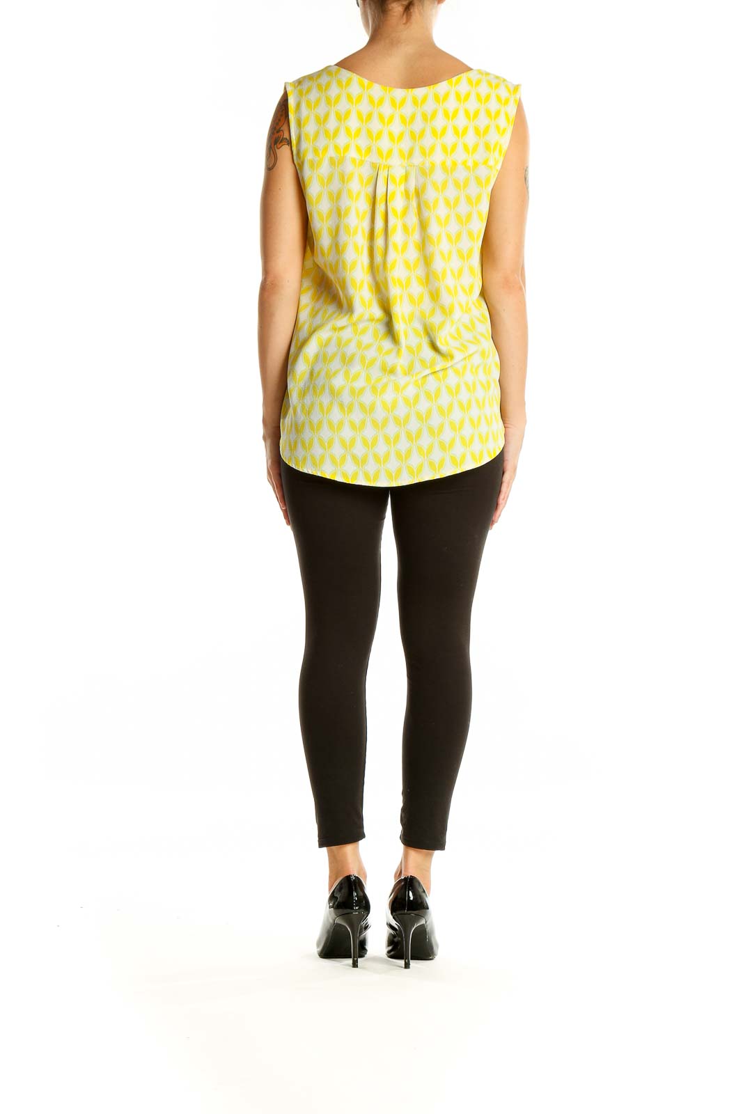 Back view of Pixley yellow geometric print sleeveless blouse showing pleat detail