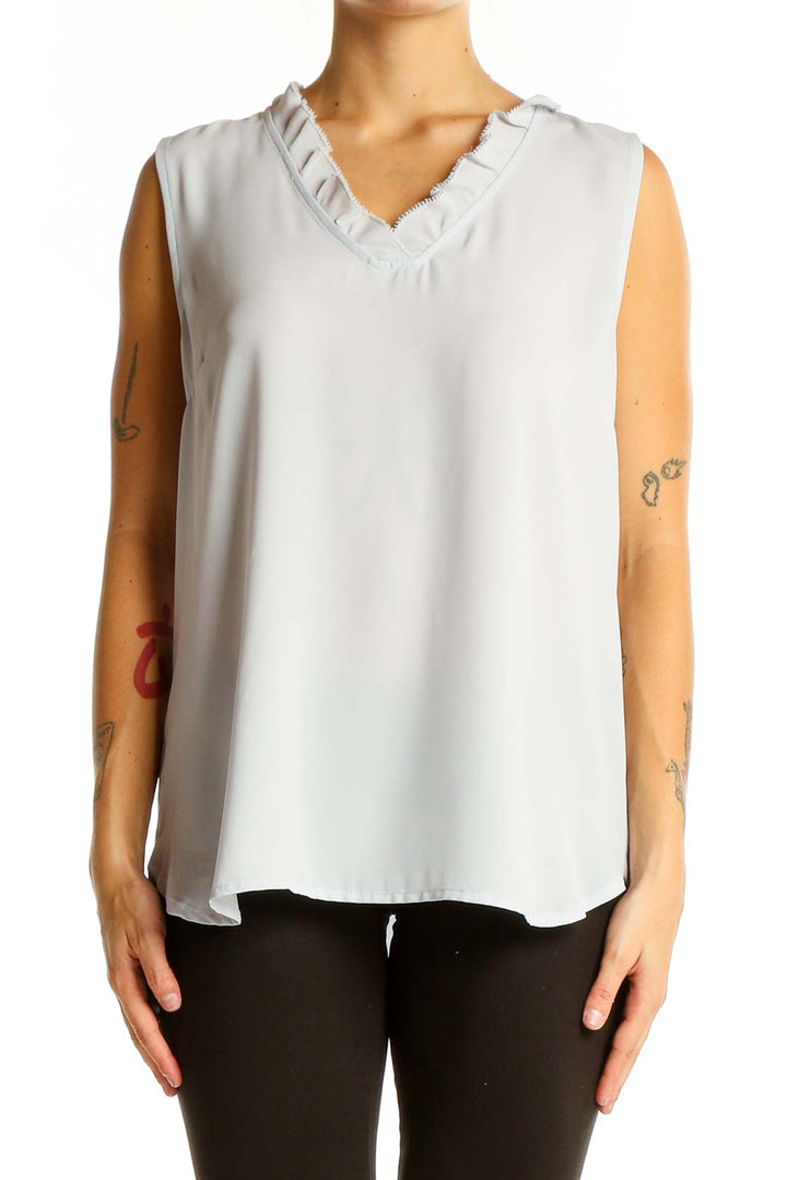 Front view of Ann Taylor white sleeveless blouse with ruffled V-neck