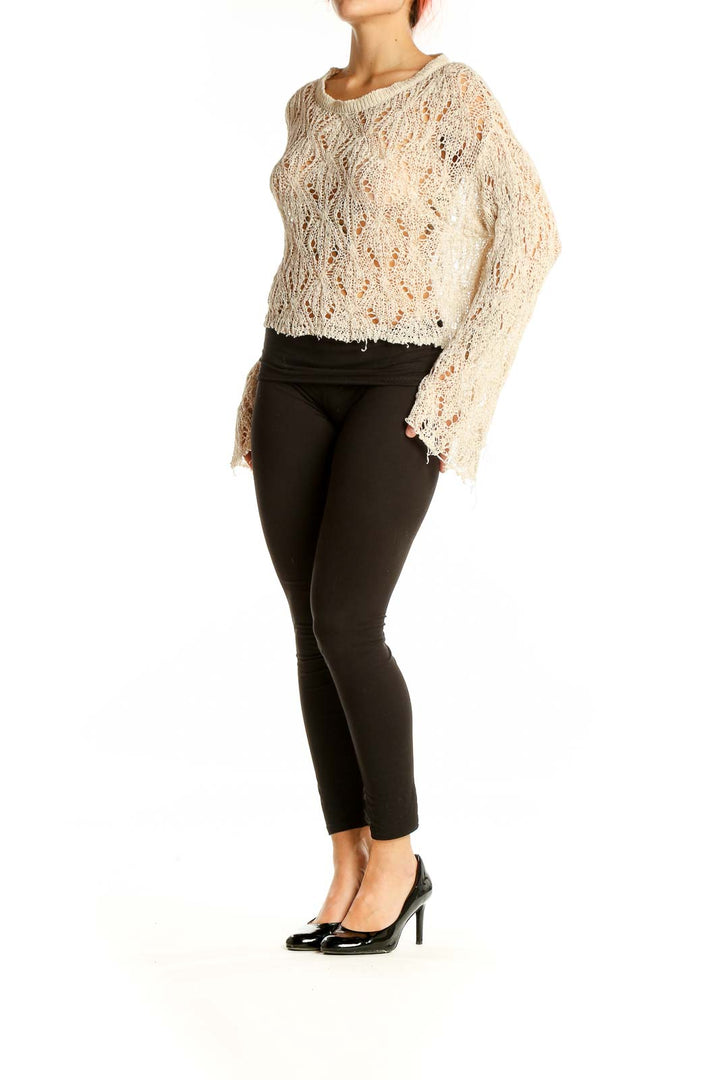 Front view of SilkRoll cream openwork knit cropped sweater