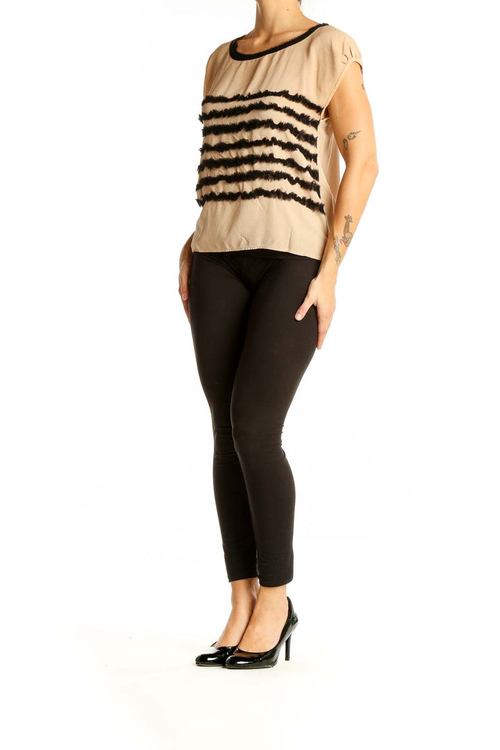 Front view of Mcginn beige cap sleeve blouse with black stripes