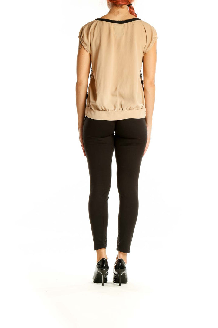 Back view of Mcginn beige cap sleeve blouse