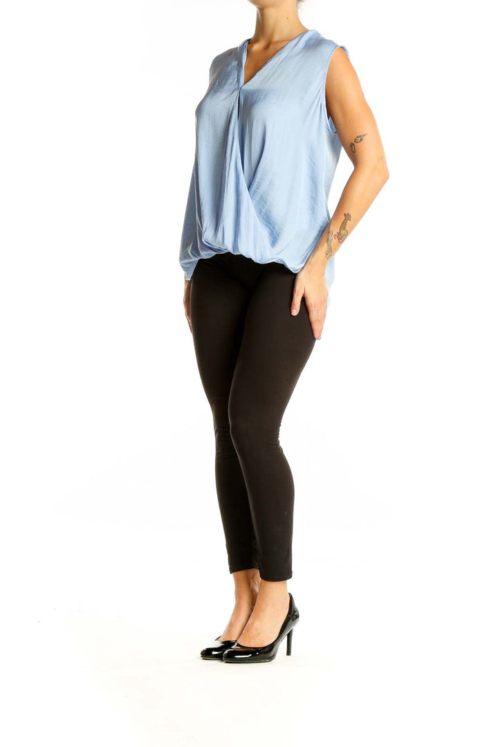 Front view of light blue sleeveless wrap top from Banana Republic