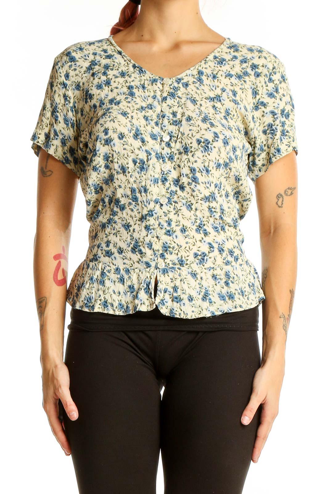 Front view of SilkRoll blue floral rayon top with short sleeves and peplum waist