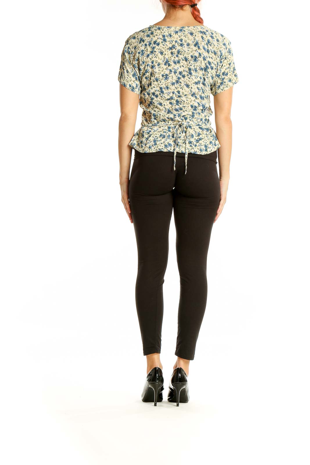 Back view of SilkRoll blue floral rayon top showing all-over print and gathered waist detail