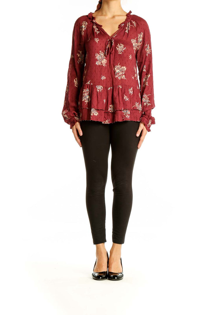 Front view of William Rast burgundy floral print peplum blouse with tie-front neckline