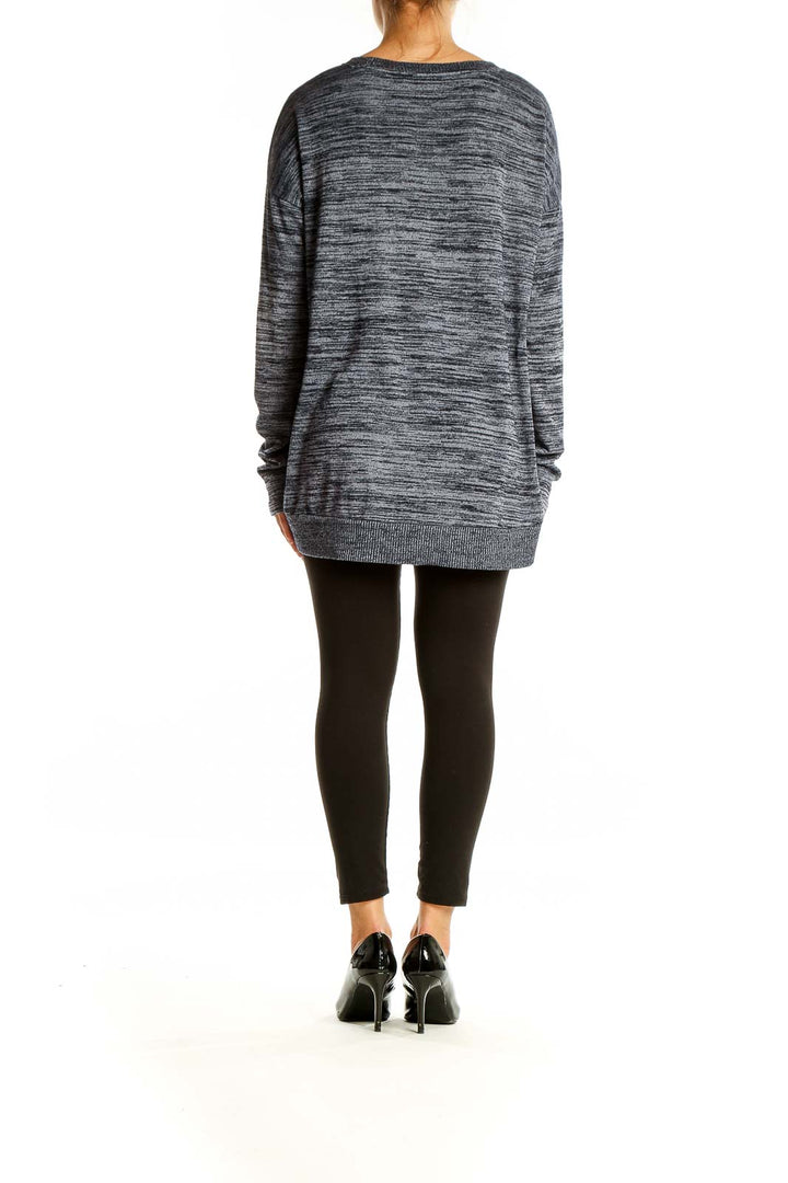 Back view of gray marled oversized knit sweater from Gap showing high-low hemline