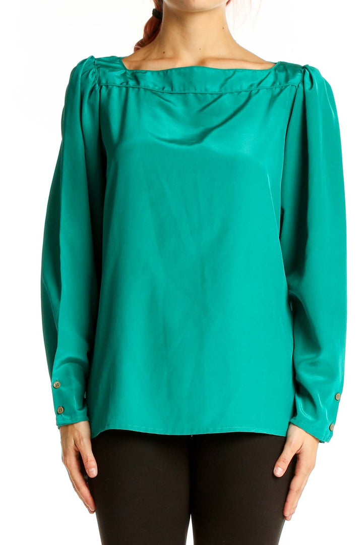 Front view of emerald green Regina Porter long-sleeve blouse with boat neckline