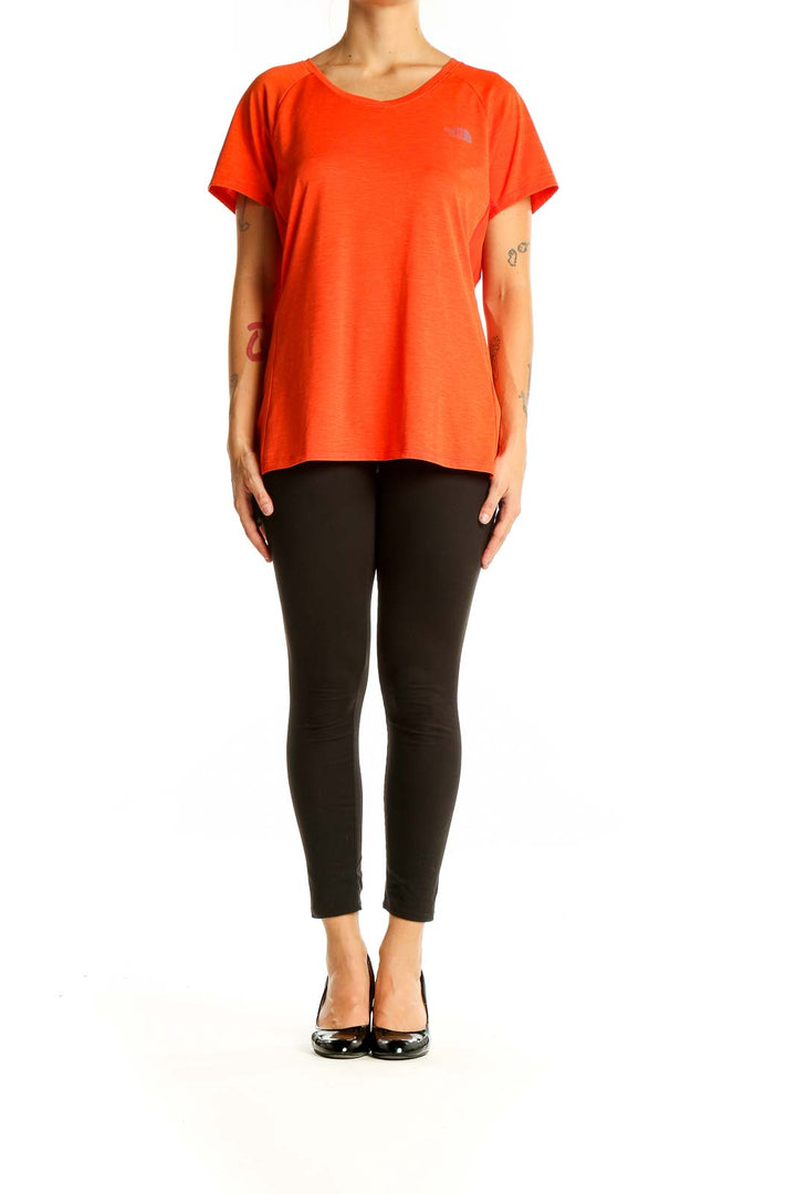 Front view of The North Face orange polyester athletic t-shirt