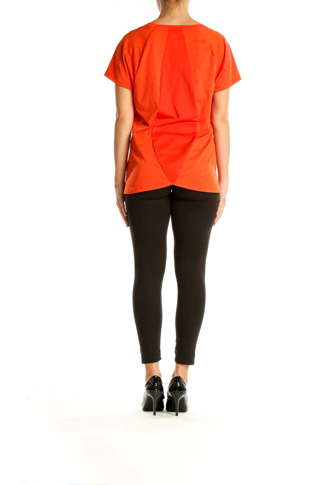 Back view of The North Face orange polyester athletic t-shirt on model