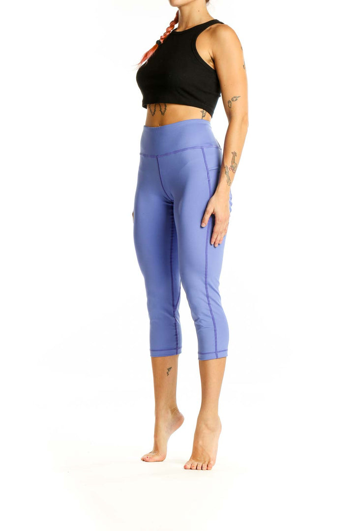 Front view of SUGOI periwinkle high-waisted capri activewear leggings