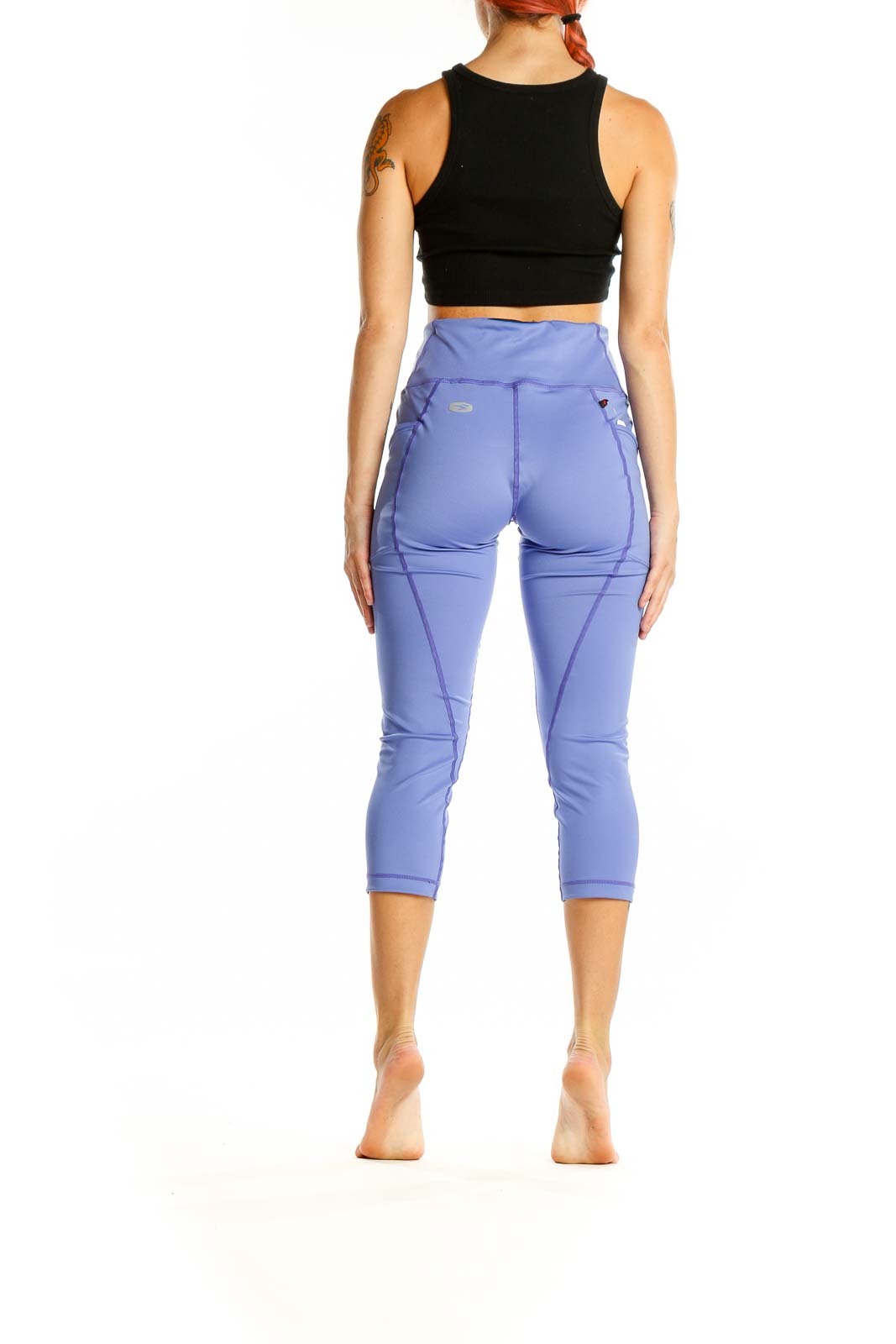 Back view of SUGOI periwinkle high-waisted capri activewear leggings