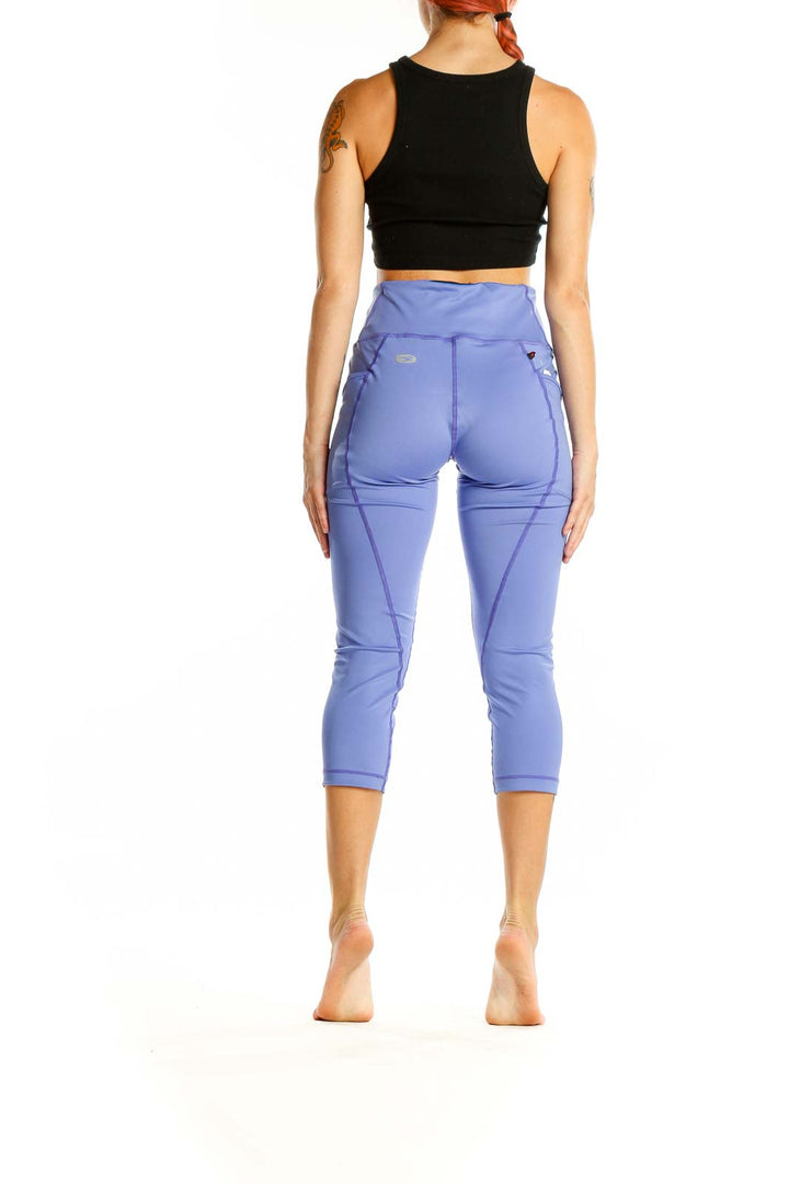 Back view of SUGOI periwinkle high-waisted capri activewear leggings