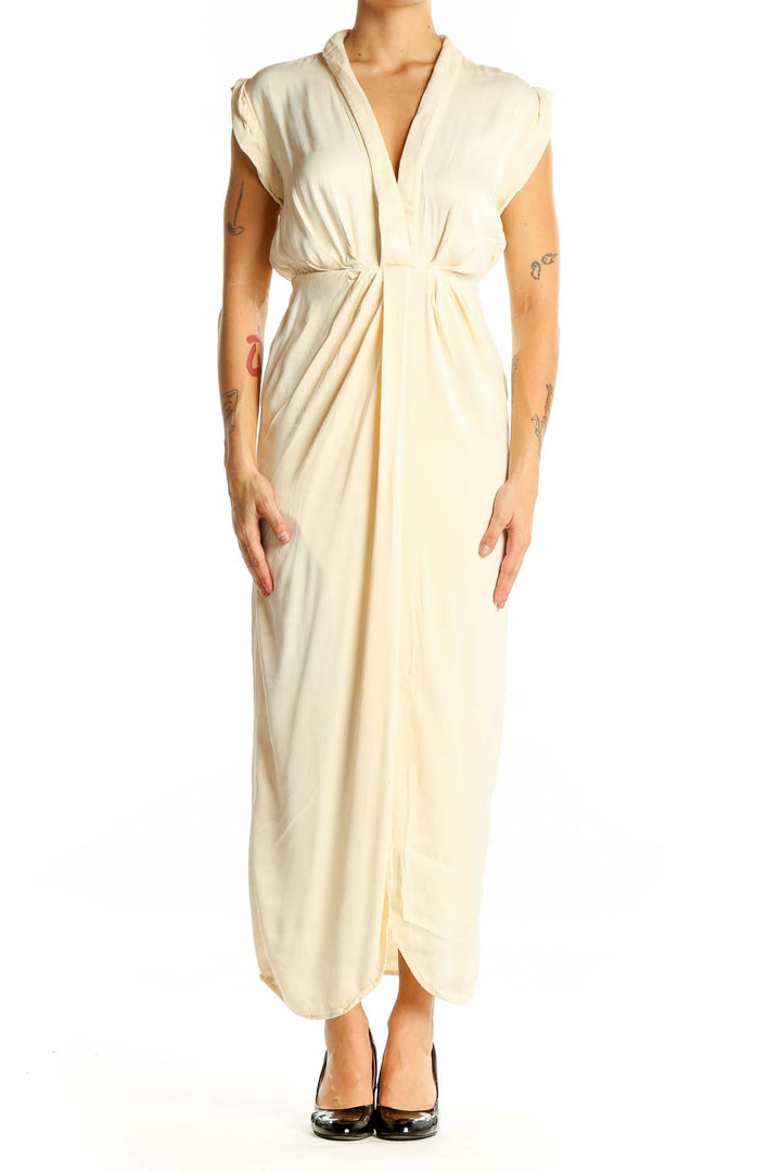 Front view of cream Anthropologie maxi dress with V-neck and gathered waist