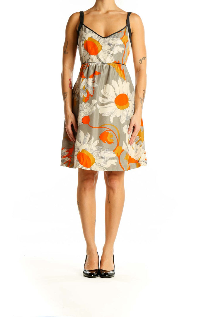 Front view of Moulinette Soeurs gray floral print sleeveless sundress with orange accents