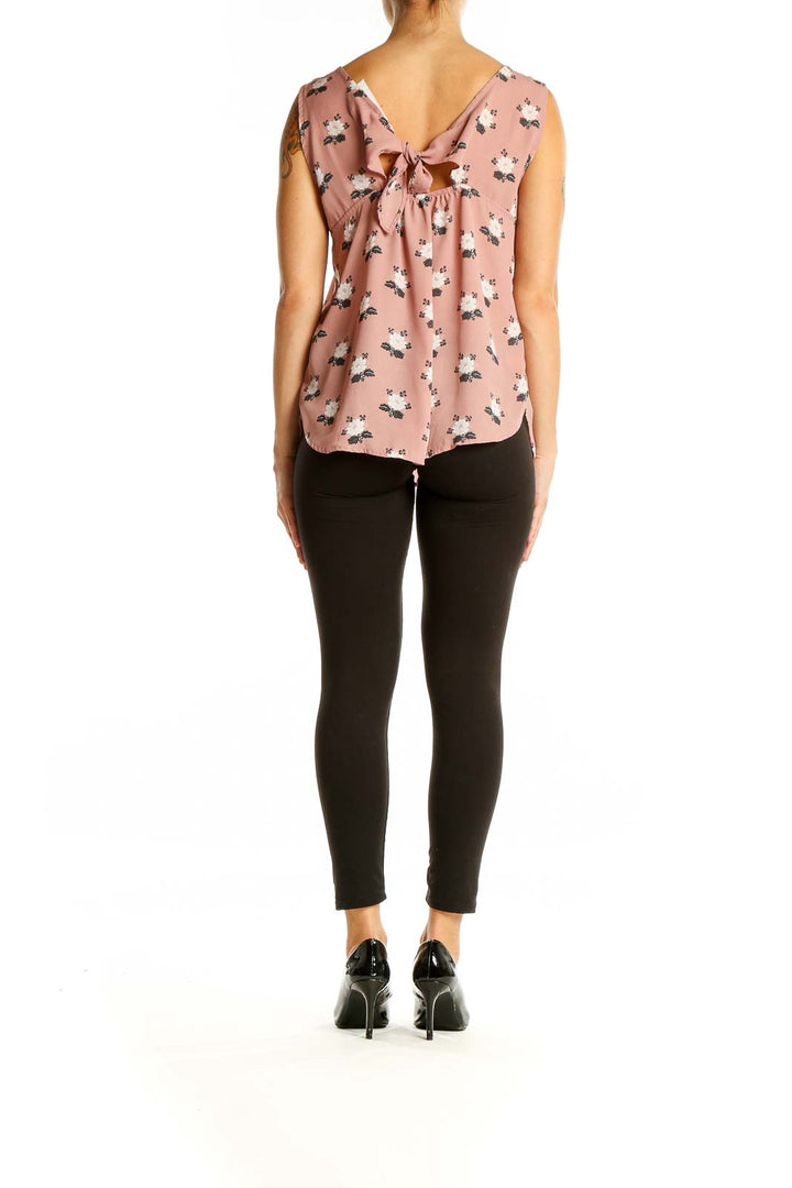 Back view of pink floral print sleeveless blouse with bow detail from LOFT Outlet