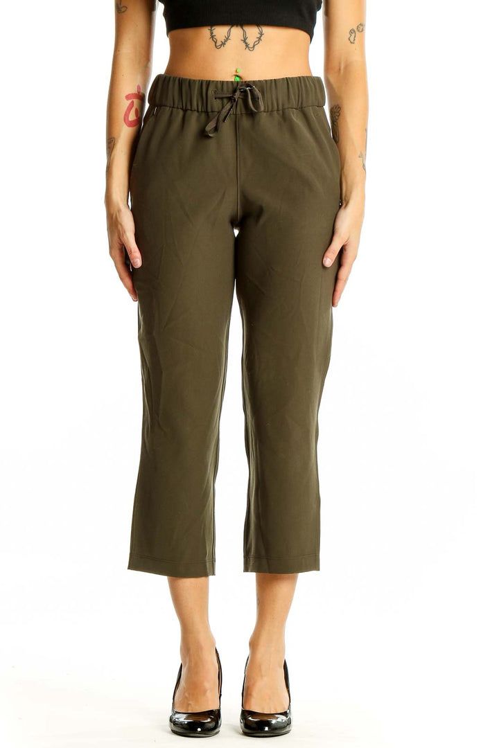 Front view of olive green Lululemon cropped activewear pants with elastic waistband