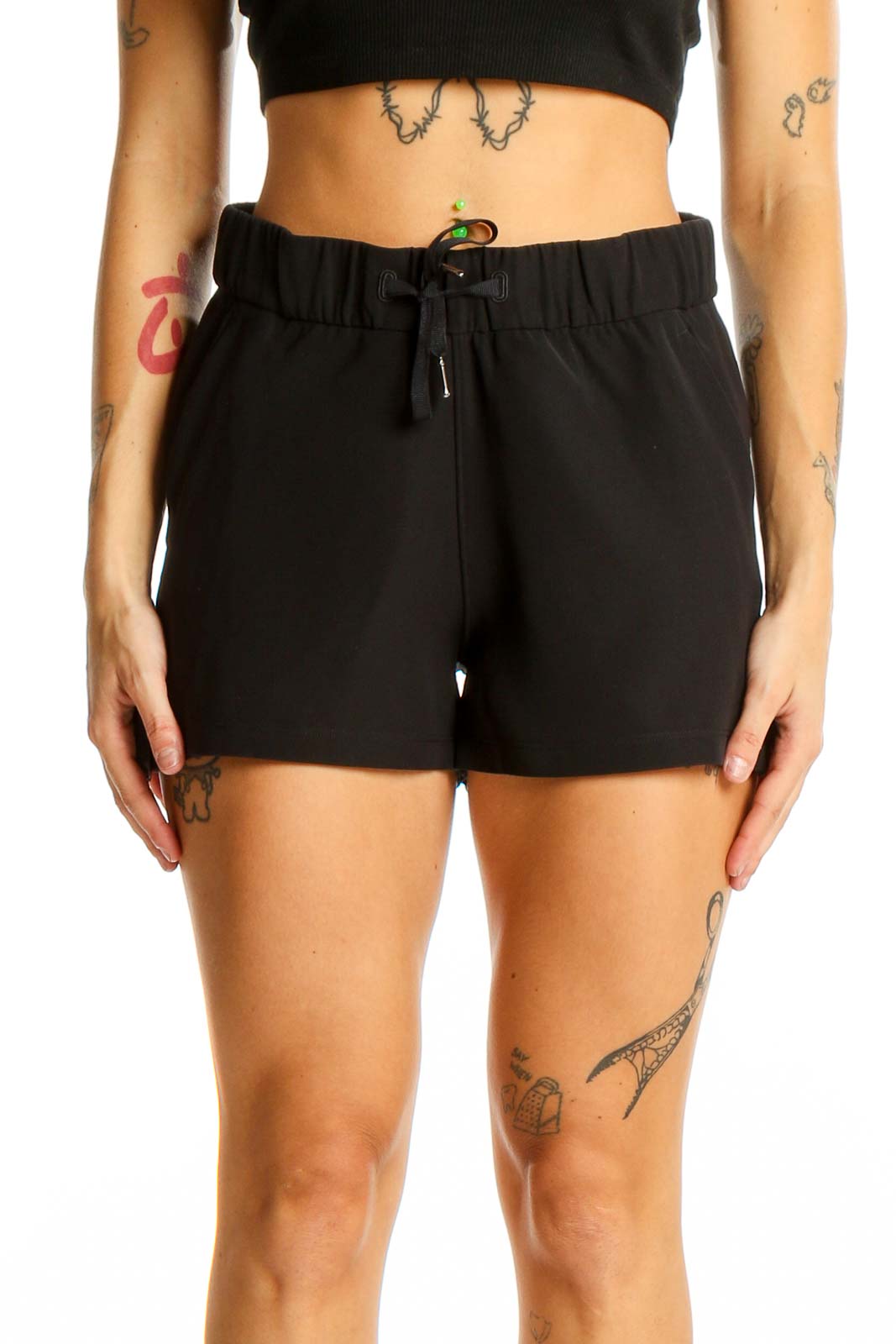 Front view of black Lululemon athletic shorts with drawstring waist