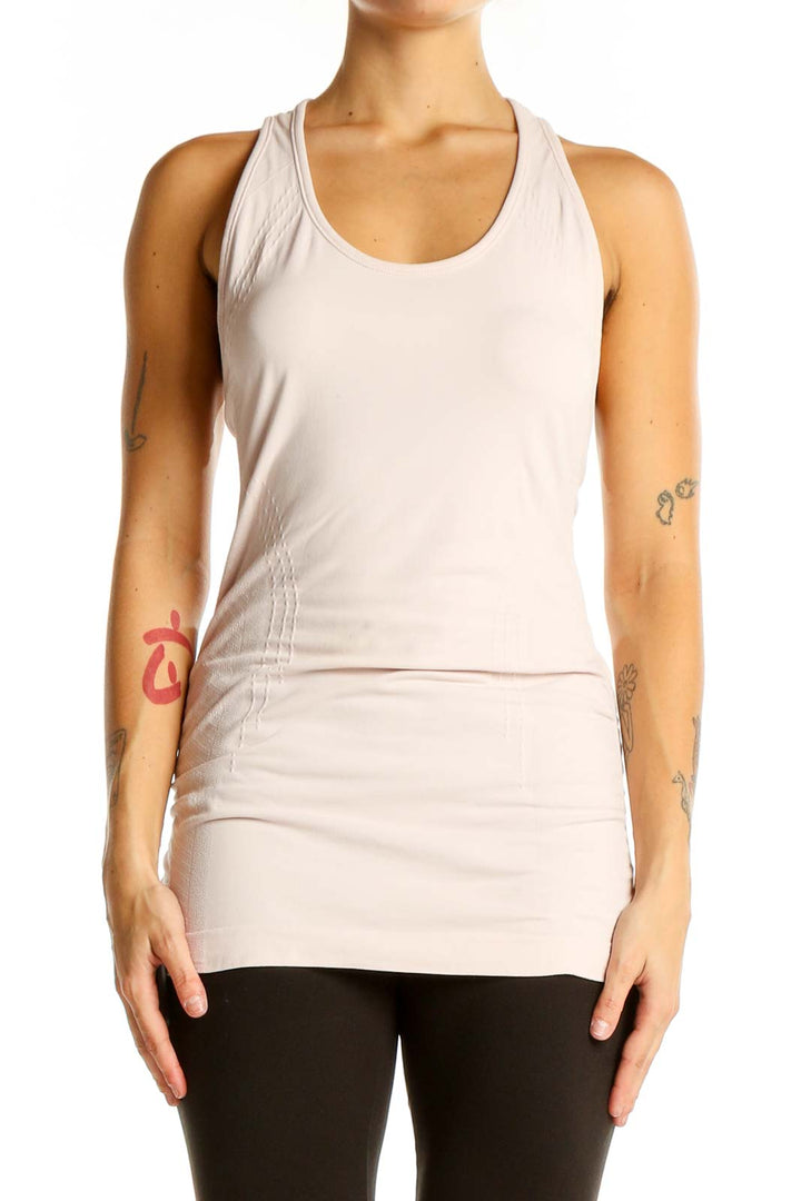 Front view of Athleta pale pink racerback athletic tank top