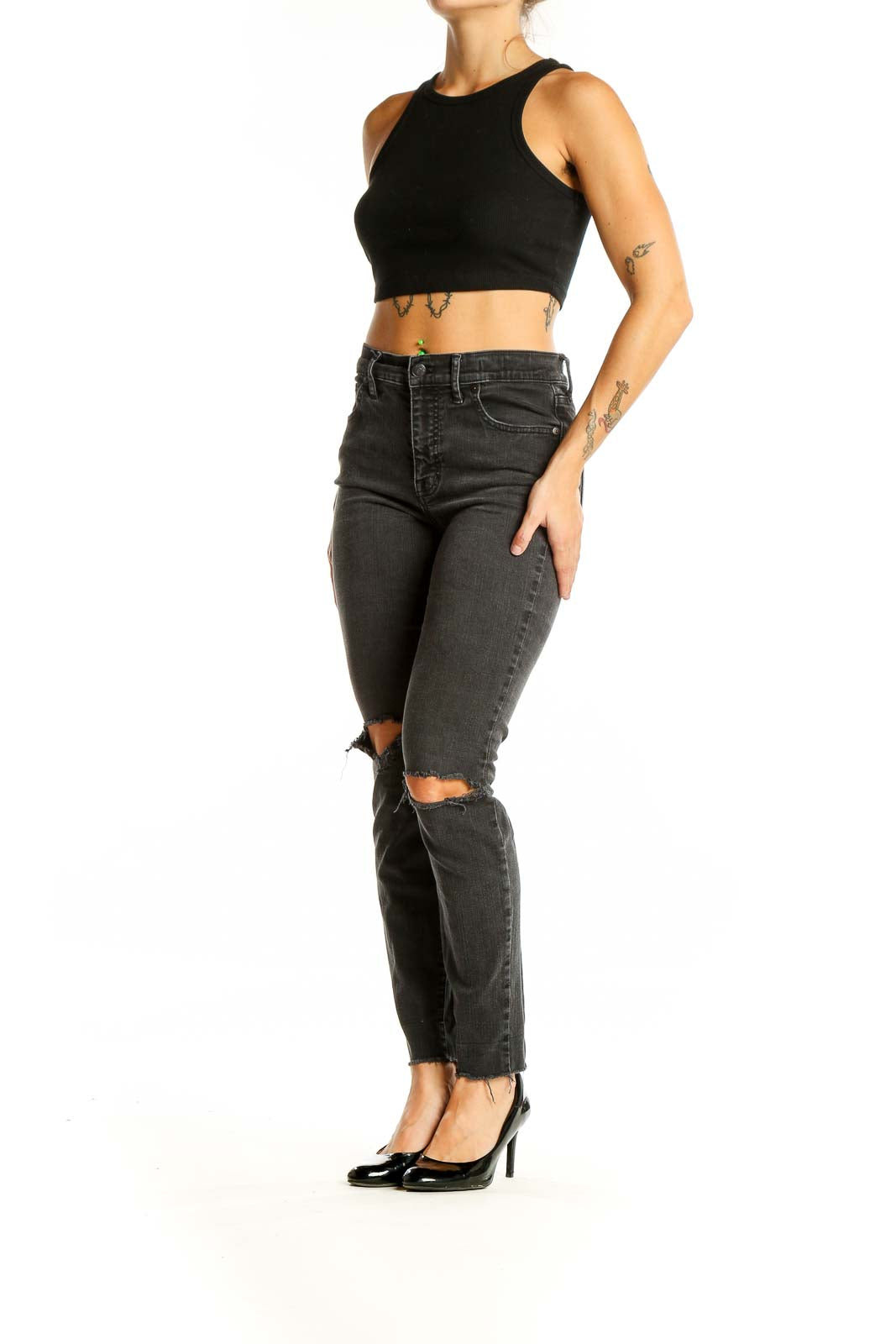 Front view of Madewell charcoal high-waisted skinny jeans with distressed knees