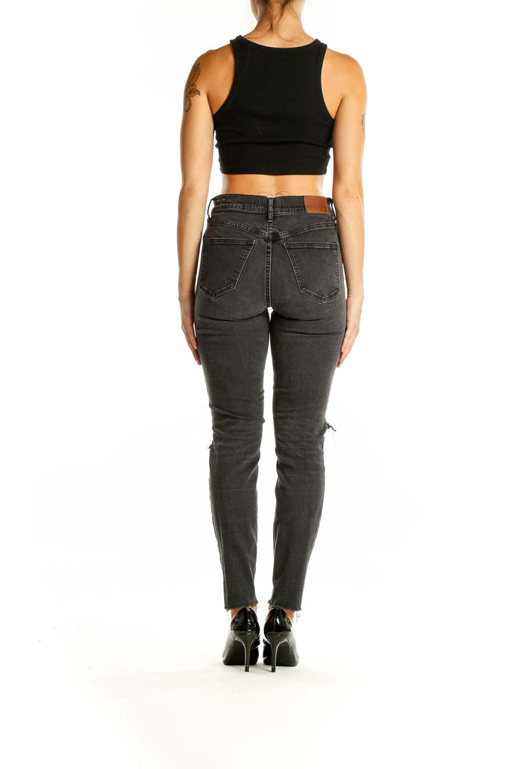 Back view of Madewell charcoal high-waisted skinny jeans showing pocket design