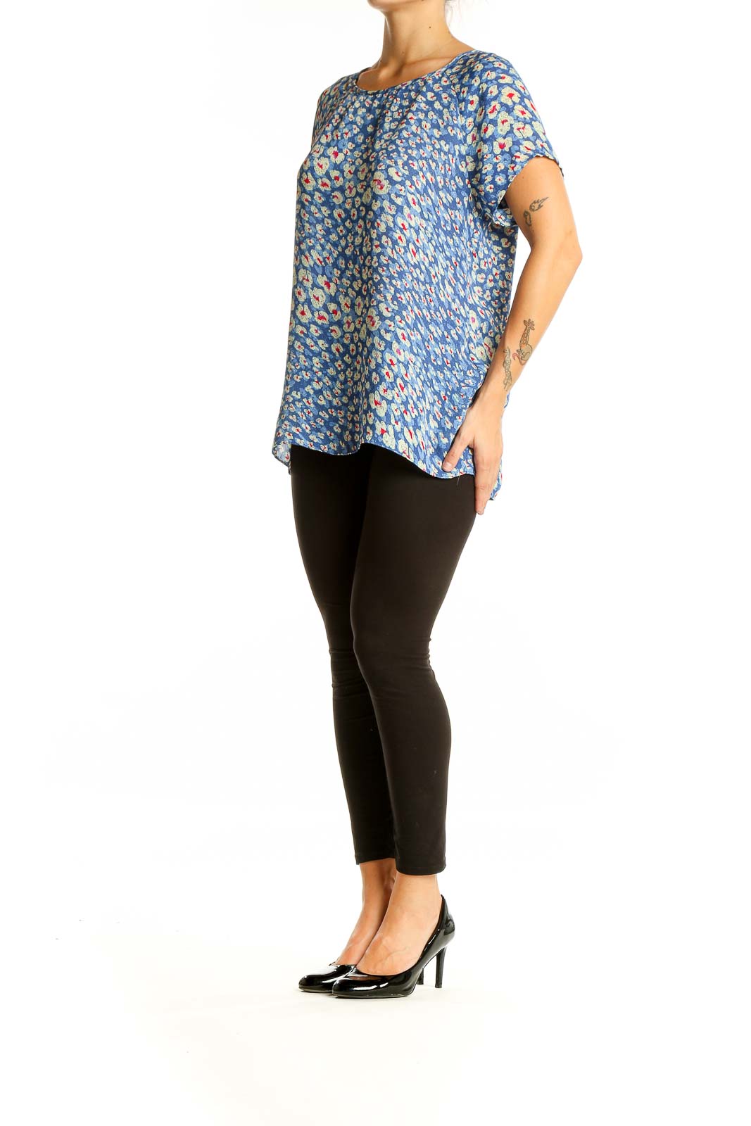 Front view of Cabi blue floral print short sleeve blouse on model