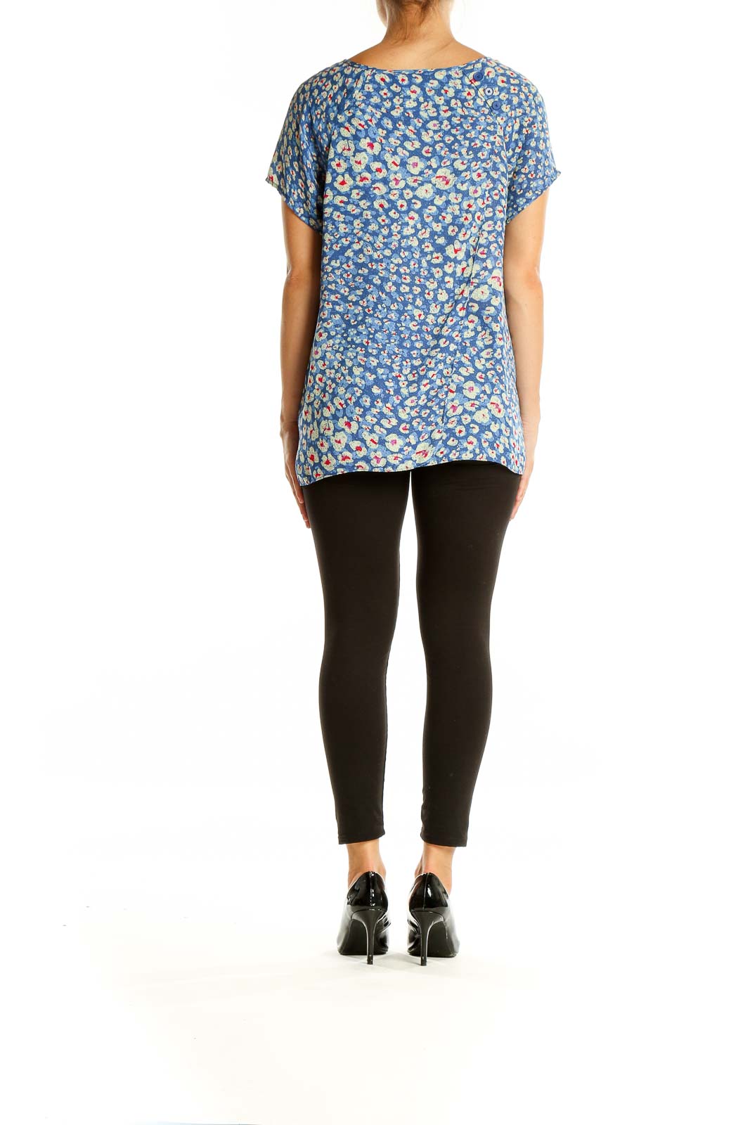 Back view of Cabi blue floral print short sleeve blouse on model