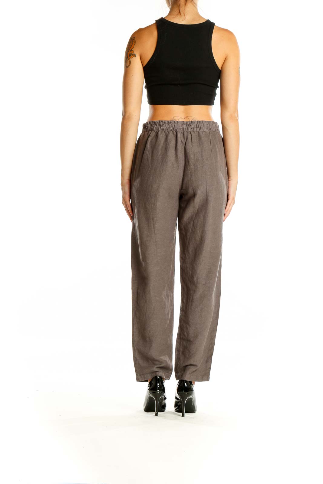 Back view of Simple Laguna brown relaxed fit pants on model