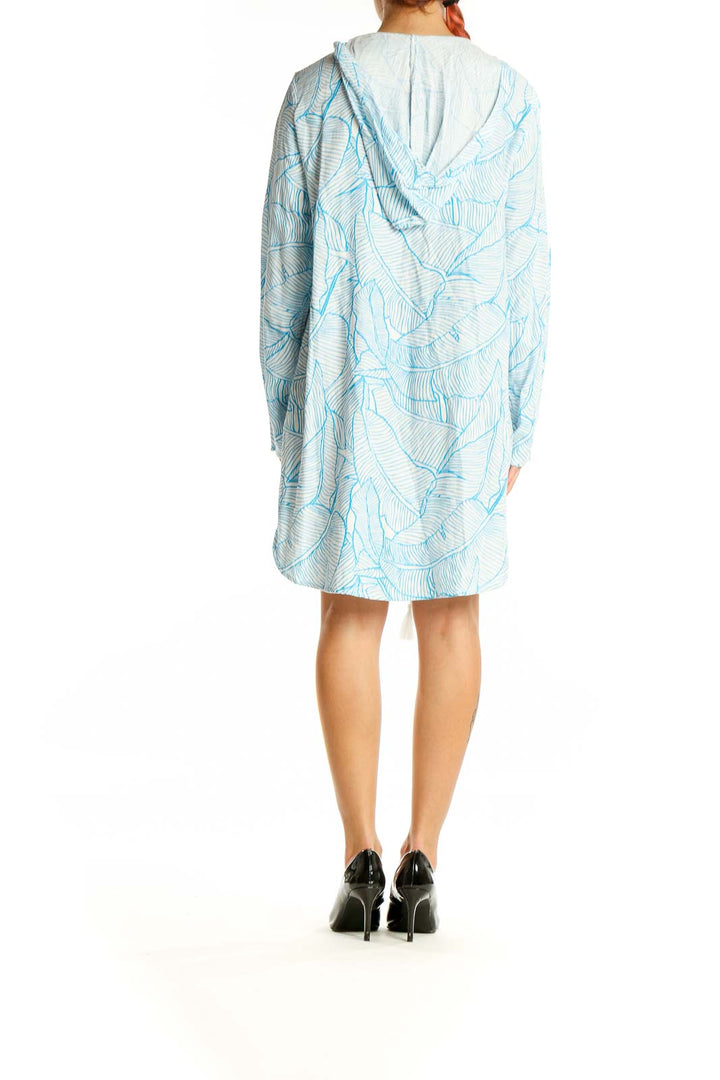 Back view of Charlie Holiday blue leaf print hooded beach dress