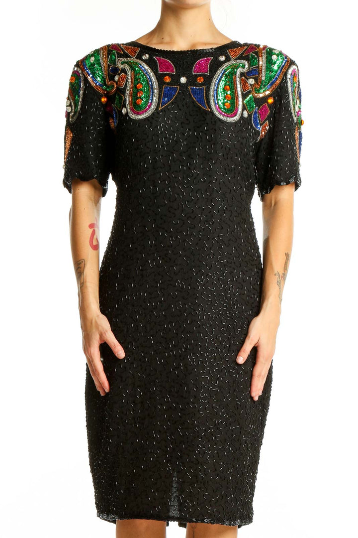 Front view of black silk Stenay cocktail dress with colorful beaded paisley design