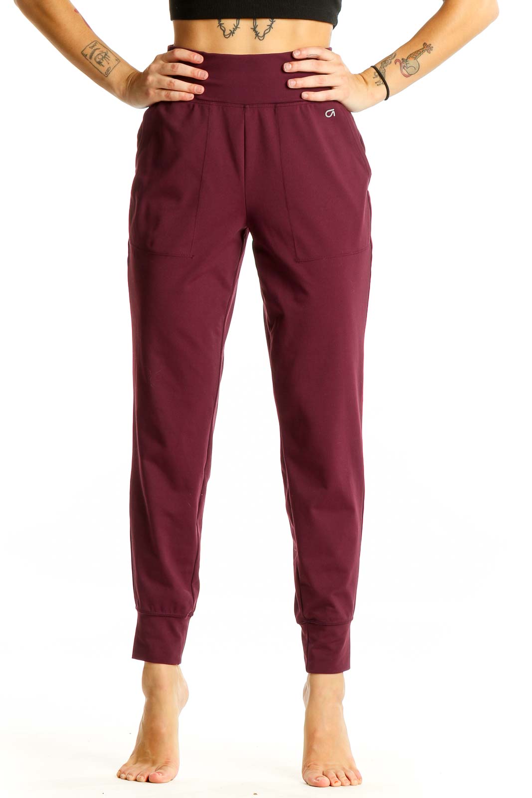 Front view of burgundy GapFit high-waisted jogger pants on model