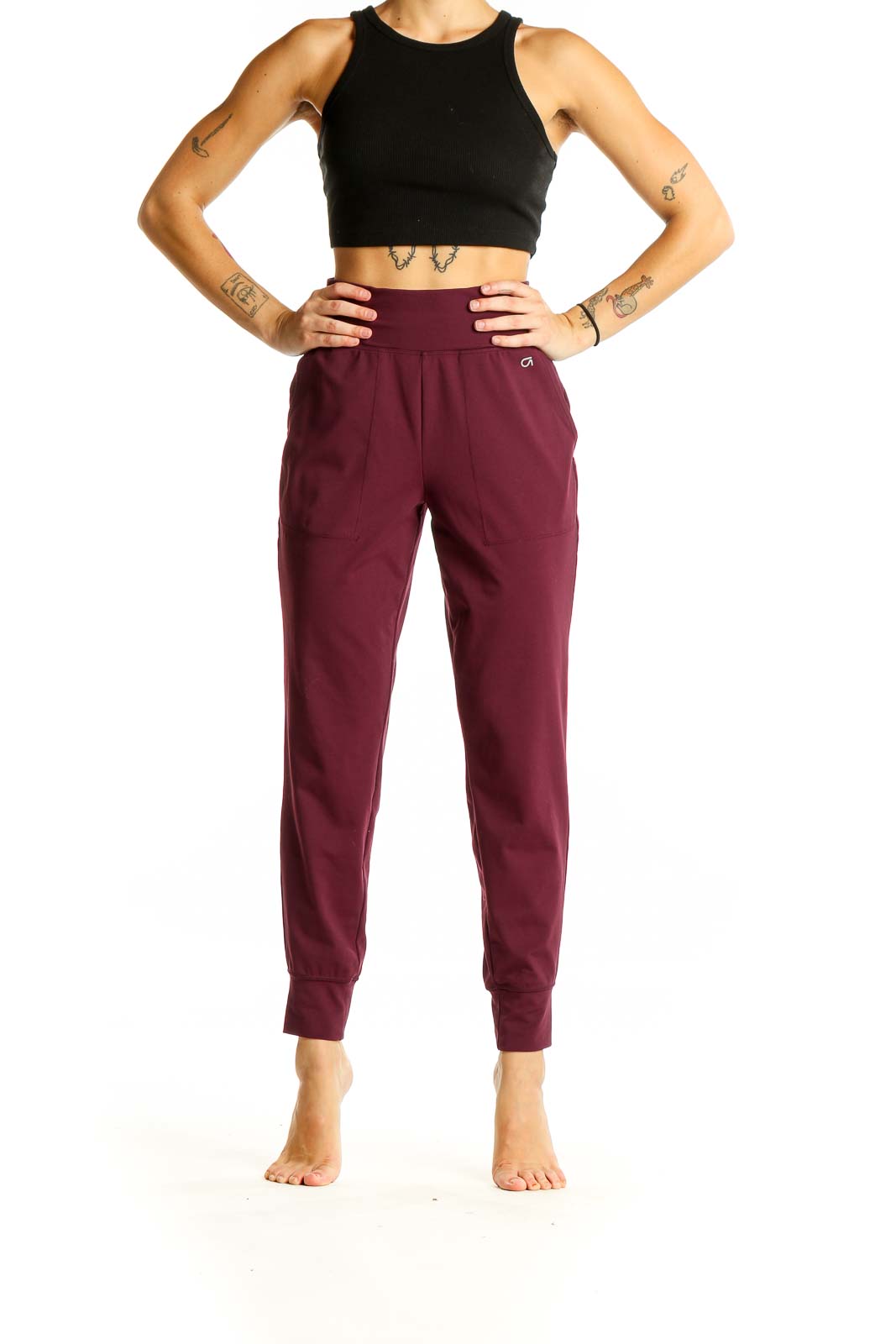 Front view of burgundy GapFit high-waisted jogger pants on model