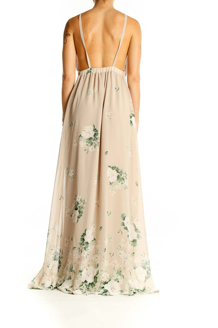 Back view of Mumu beige floral maxi dress showing open back design