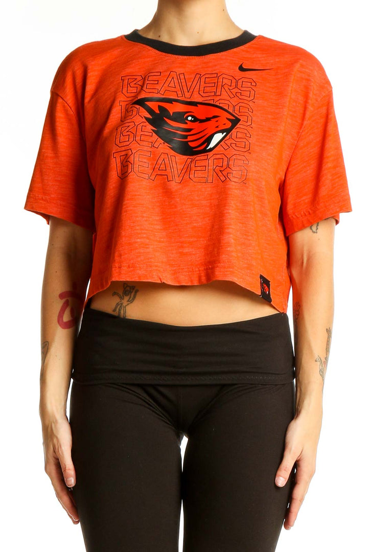 Front view of orange Nike cropped t-shirt with Beavers graphic print