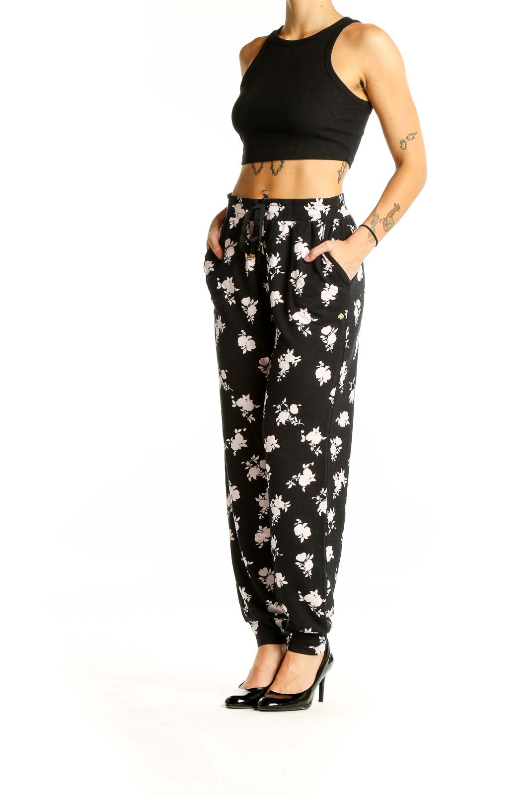 Front view of Kate Spade black pants with white floral print and drawstring waist