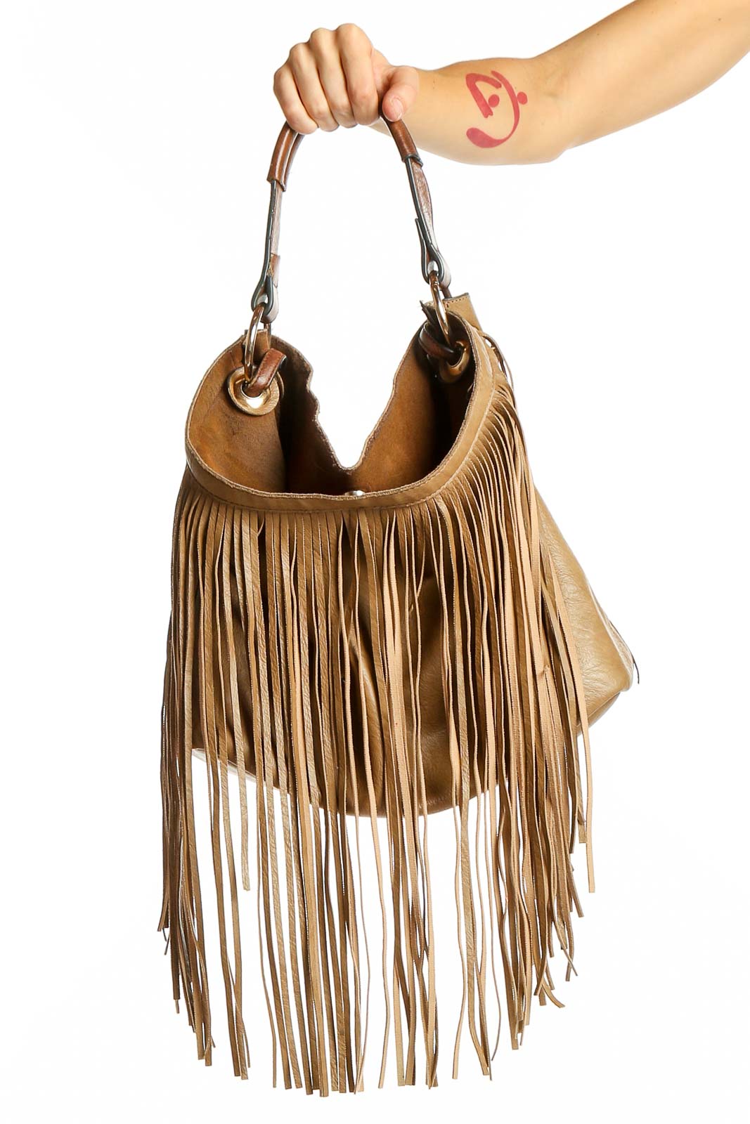 Front view of tan leather fringe hobo bag with long tassels