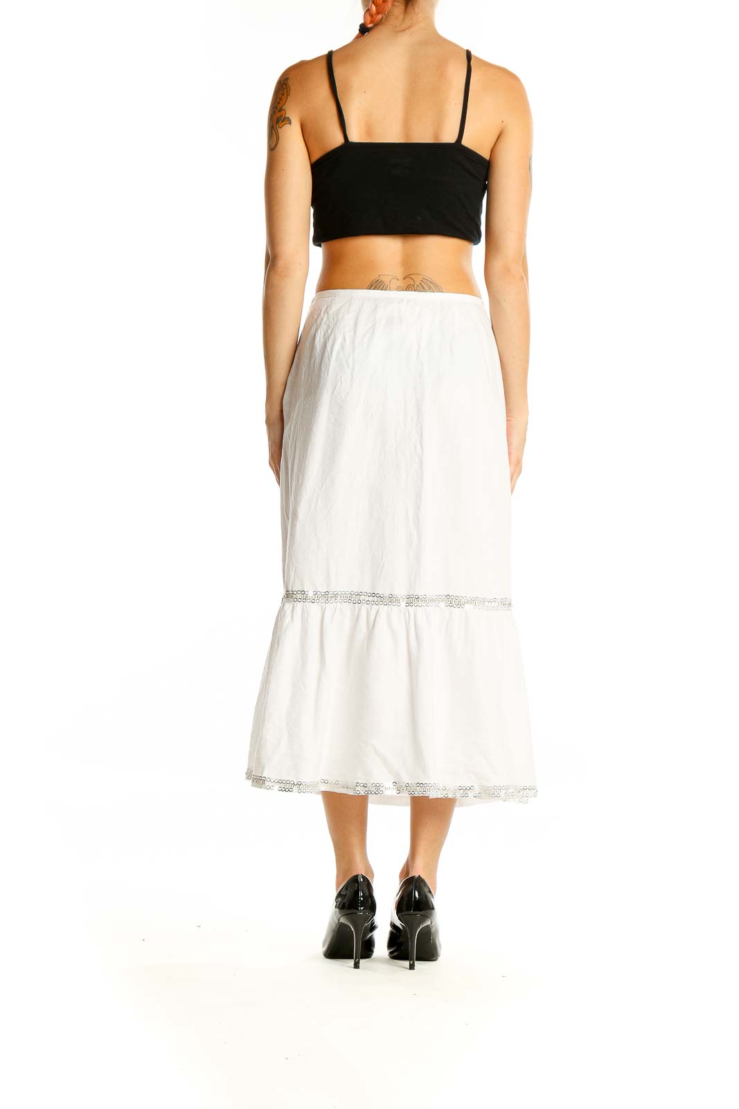 Back view of LOFT white linen tiered midi skirt on model