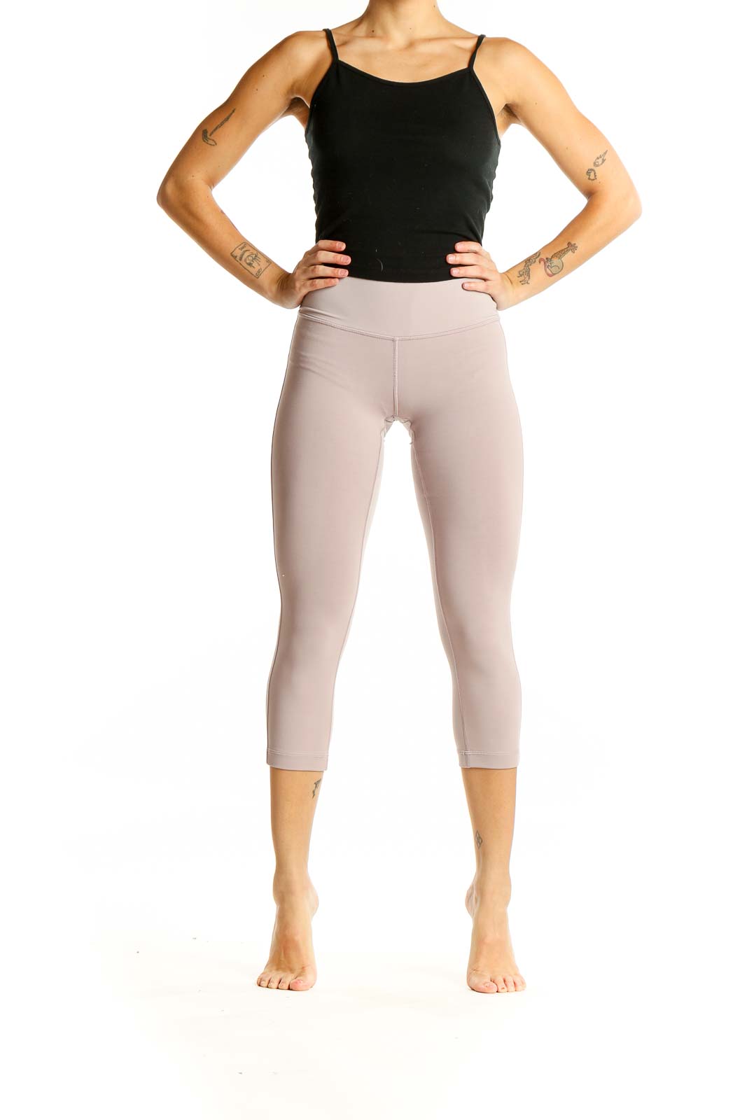 Front view of beige Lululemon high-waisted capri leggings