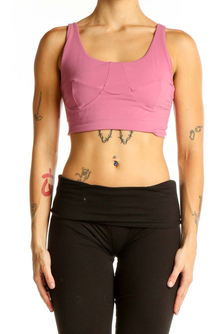 Front view of pink Lululemon crop top on model