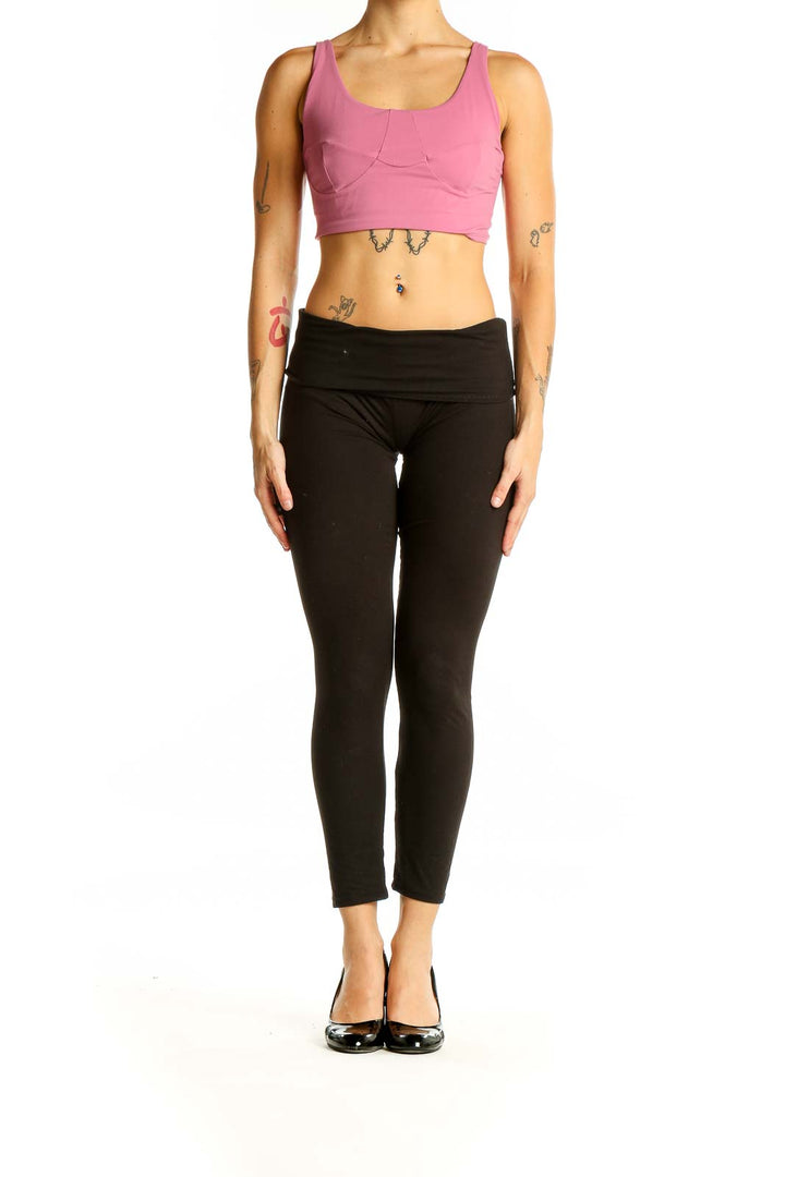 Front view of pink Lululemon crop top on model