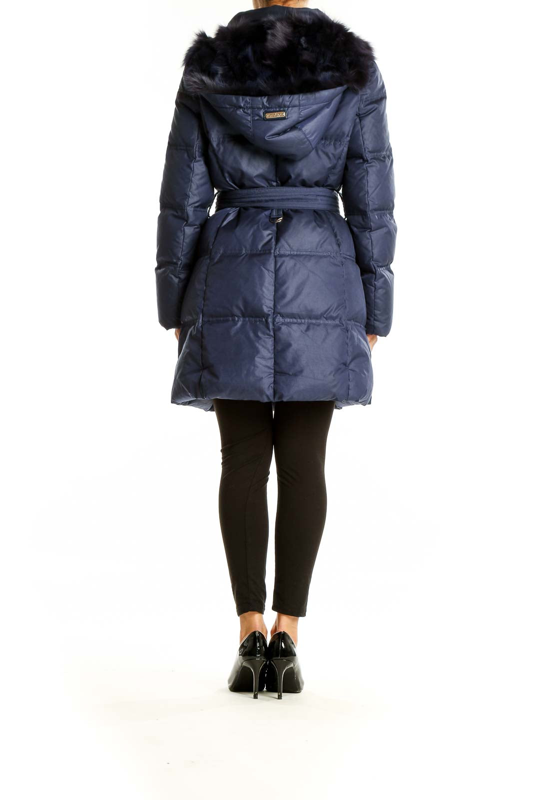 Back view of navy Scofield puffer coat showing quilted design and fur-trimmed hood