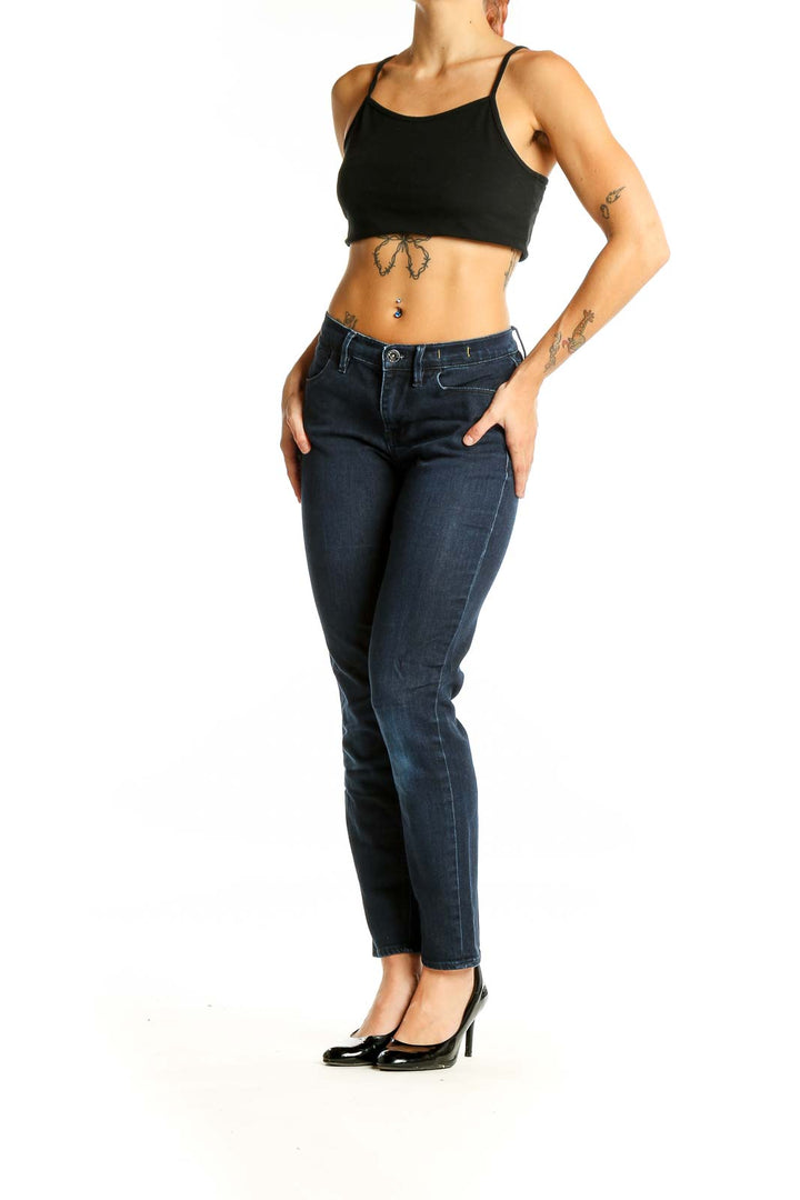 Front view of Madewell dark blue straight leg jeans on model