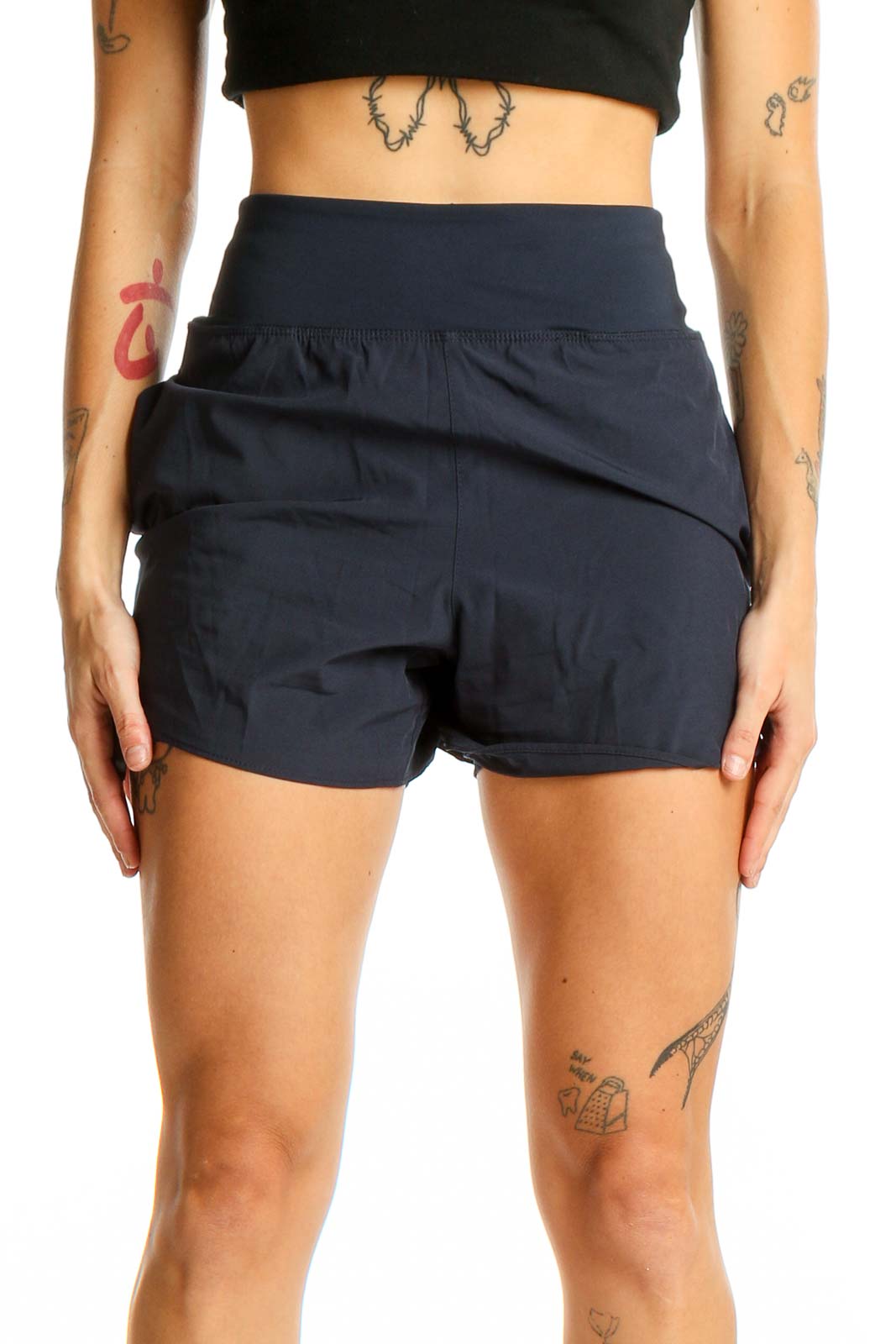 Front view of Avia navy high-waisted athletic shorts on model