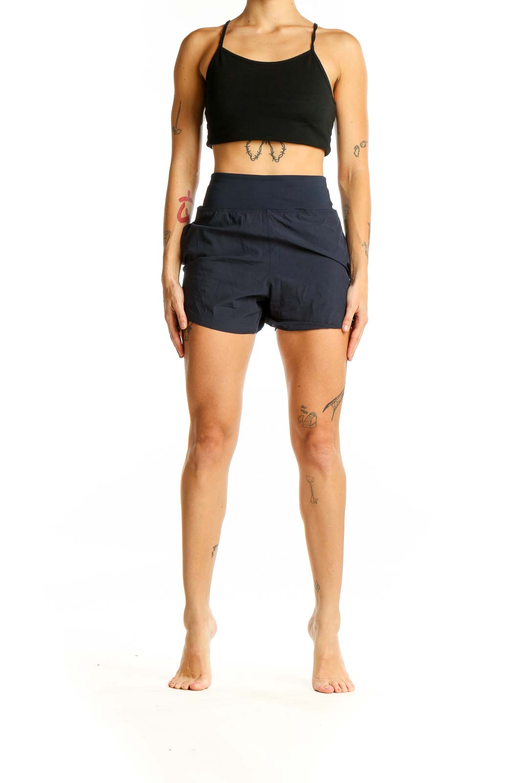 Front view of Avia navy high-waisted athletic shorts on model