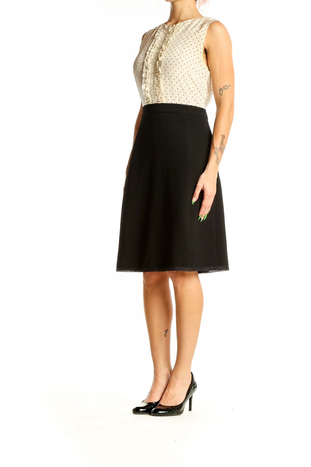 Front view of J.Crew cream polka dot sleeveless dress with black skirt